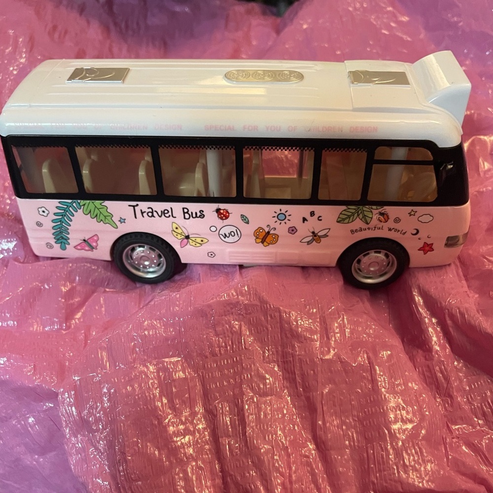 Pink Travel Bus Toy lights up makes noises